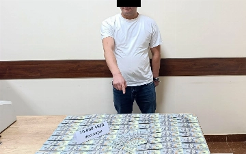 Qibray tumani hokimining mahalladagi yordamchisi 10 ming dollar bilan ushlandi