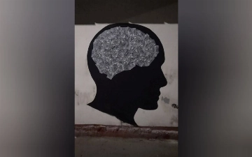 Inkuzart нарисовал новое граффити, посвященное страсти к наживе — видео